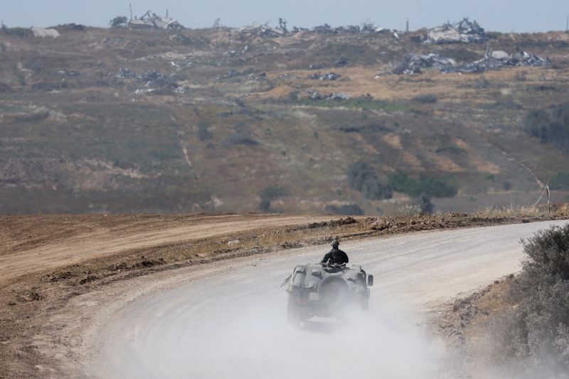 &copy; Reuters. FILE PHOTO: An Israeli military vehicle manoeuvres, near the Israel-Gaza border, amid the ongoing conflict between Israel and the Palestinian Islamist group Hamas, in Israel, April 15, 2024. REUTERS/Amir Cohen/File Photo