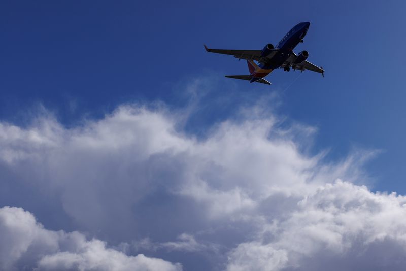 &copy; Reuters. FILE PHOTO: A Southwest Airlines flight descends past stormy clouds as it approaches to land in San Diego, California, U.S., December 12, 2022.  REUTERS/Mike Blake/File Photo