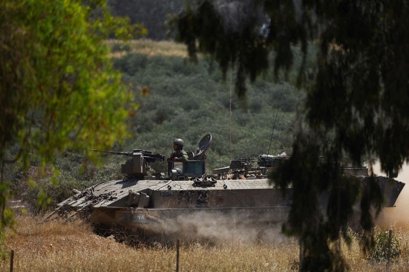 © Reuters. An Israeli soldier sits in a military vehicle near Israel's border with Gaza, amid the ongoing conflict between Israel and the Palestinian Islamist group Hamas, in Israel, April 17, 2024. REUTERS/Hannah McKay