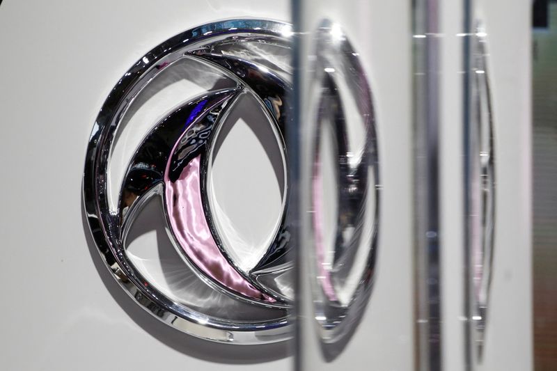 &copy; Reuters. FILE PHOTO: The logo of Dongfeng Motor Corp is seen behind glass door at the Auto China 2016 auto show in Beijing, China, April 26, 2016. REUTERS/Kim Kyung-Hoon/File Photo