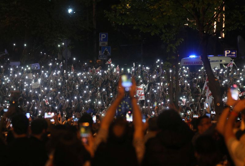 © Reuters. People take part in a protest against a draft bill on 