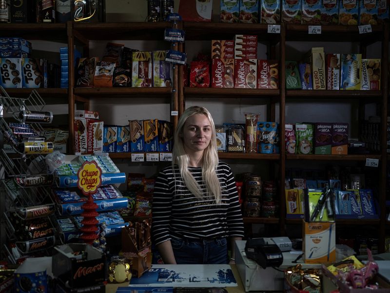 &copy; Reuters. Marija Jankucic, 20, who is a student, poses for a picture inside the grocery shop where she works, in the village of Krivelj, Serbia, April 3, 2024. "I am hoping for a new village in a peaceful area," said Jankucic during an interview with Reuters. REUTE