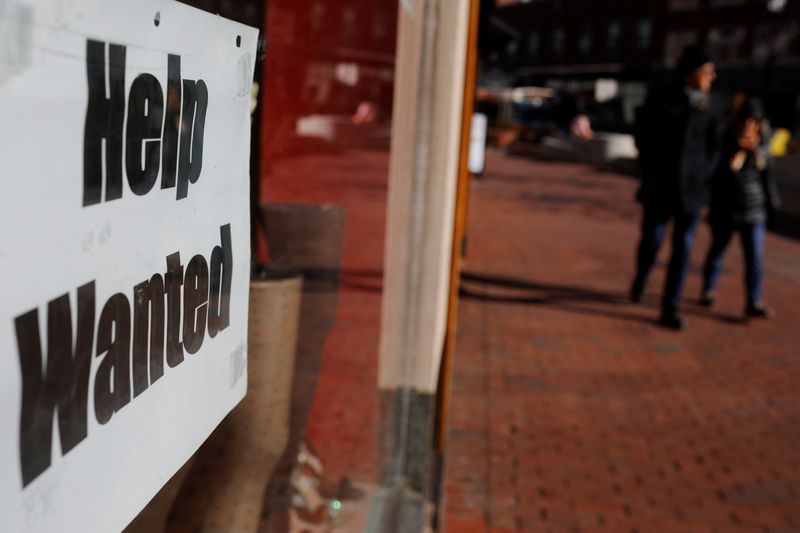 &copy; Reuters. FILE PHOTO: A "Help Wanted" sign sits in the window of a shop in Harvard Square in Cambridge, Massachusetts, U.S., February 11, 2019.   REUTERS/Brian Snyder/File Photo