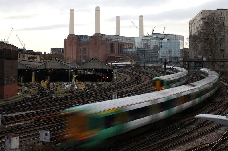 &copy; Reuters. Trains pass in front of Battersea Power Station as they leave Victoria station in London, Britain, February 10, 2023. REUTERS/Henry Nicholls/File Photo