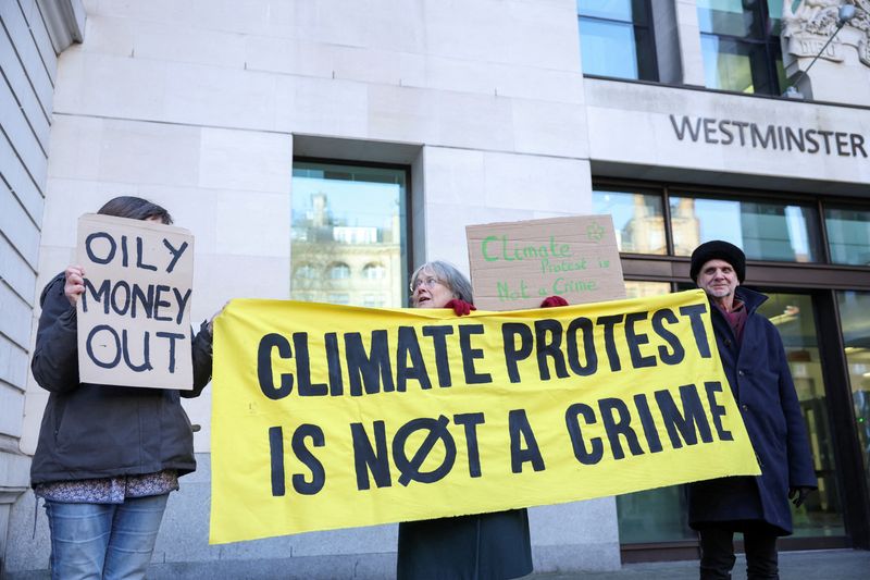 &copy; Reuters. FILE PHOTO: Climate change protesters hold signs outside Westminster Magistrates' Court, on the day of Greta Thunberg's trial in London, Britain, February 1, 2024. REUTERS/Isabel Infantes/File Photo