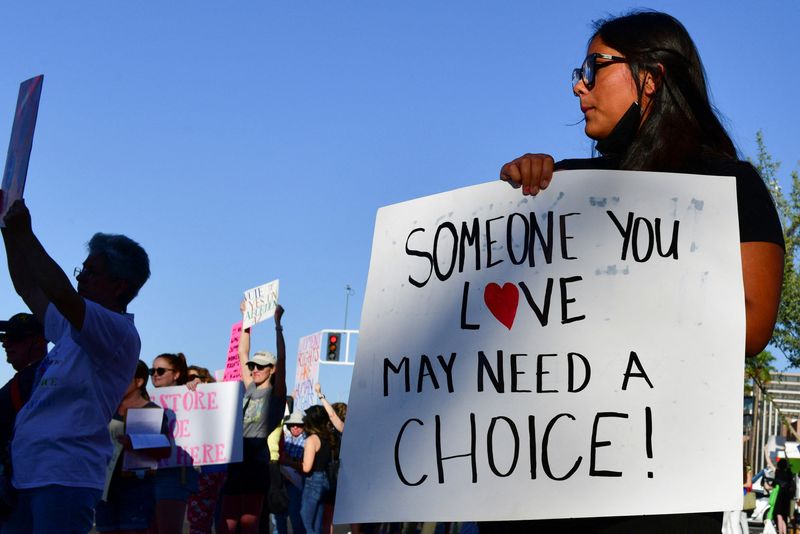 &copy; Reuters. FILE PHOTO: A woman holds a sign at a protest in the district of Republican state Representative Matt Gress after Arizona's Supreme Court revived a law dating to 1864 that bans abortion in virtually all instances, in Scottsdale, Arizona, U.S. April 14, 20