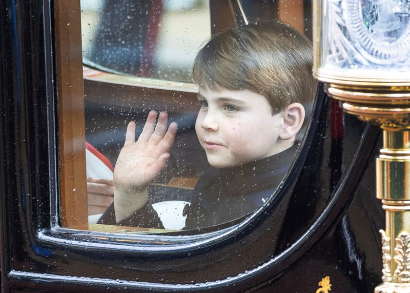 &copy; Reuters. London, United Kingdom 06/05/2023 - Prince Louis waves to the crowds after the Coronation of King Charles the III and Queen Camilla as the proceed down the Mall.  Joshua Bratt/Pool via REUTERS/File Photo