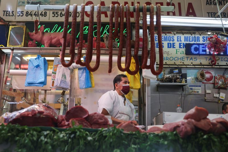 &copy; Reuters. FILE PHOTO: A butcher sells meat at a market in Mexico City, Mexico, January 19, 2022. REUTERS/Edgard Garrido/File Photo