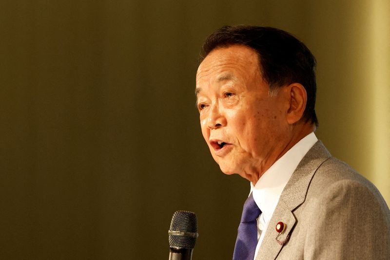 &copy; Reuters. FILE PHOTO: Japan's former prime minister and current vice vresident of the ruling Liberal Democratic Party, Taro Aso, speaks during the Ketagalan Forum in Taipei, Taiwan August 8, 2023. REUTERS/Carlos Garcia Rawlins/File Photo
