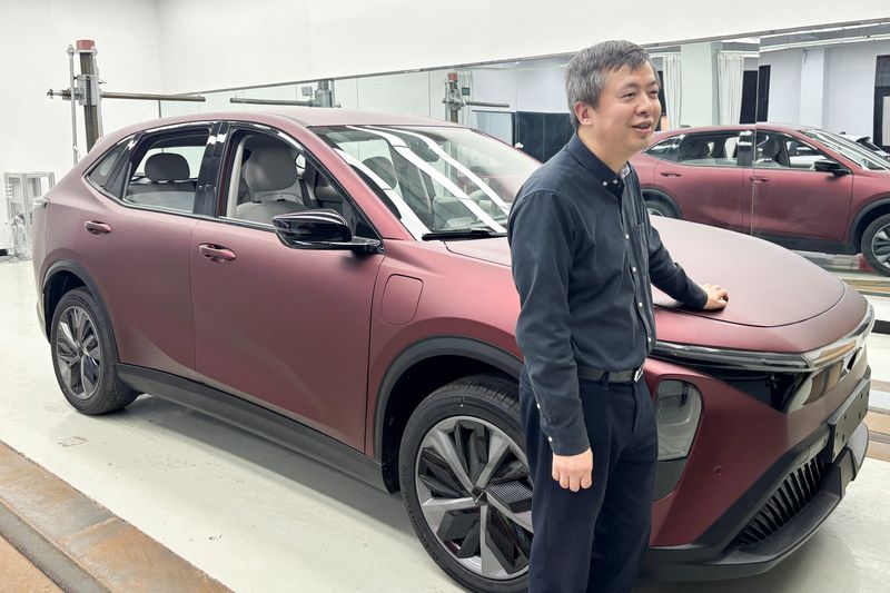&copy; Reuters. Wang Xun, founder and chairman of the auto design and engineering firm Launch Design, poses for a picture next to a prototype vehicle at the company's office in Shanghai, China April 18, 2024. REUTERS/Sarah Wu