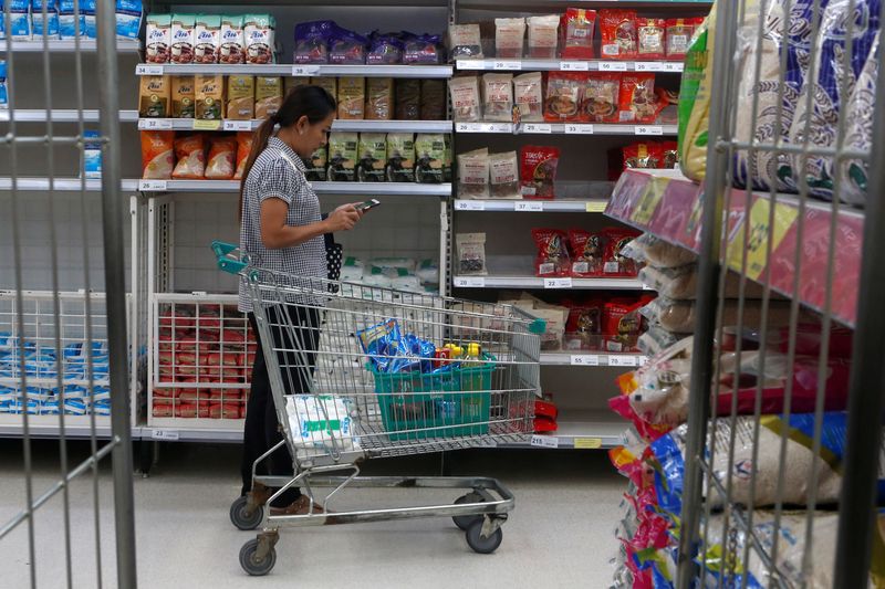 &copy; Reuters. FILE PHOTO: A woman shop sat a supermarket inside a department store in central Bangkok, Thailand, January 31, 2017. Picture taken January 31, 2017. REUTERS/Chaiwat Subprasom/File Photo
