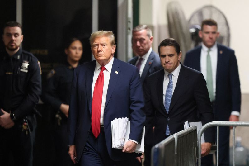 &copy; Reuters. Republican presidential candidate and former U.S. President Donald Trump walks with his attorney Todd Blanche, as his criminal trial over charges that he falsified business records to conceal money paid to silence porn star Stormy Daniels in 2016 continue