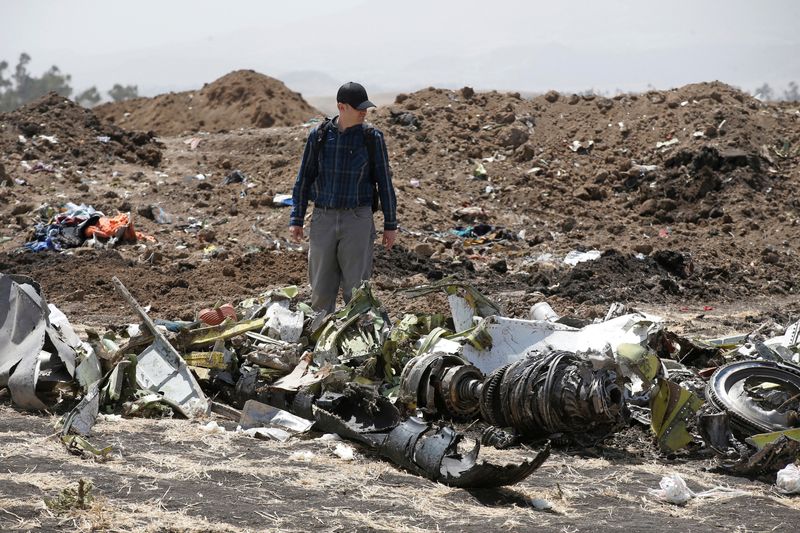 &copy; Reuters. FILE PHOTO: American civil aviation and Boeing investigators search through the debris at the scene of the Ethiopian Airlines Flight ET 302 plane crash, near the town of Bishoftu, southeast of Addis Ababa, Ethiopia March 12, 2019. REUTERS/Baz Ratner/File 