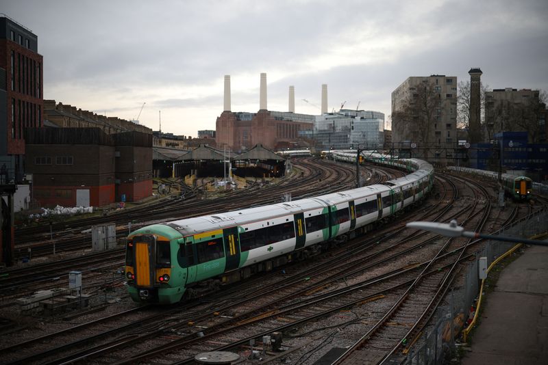 &copy; Reuters. A train passes in front of Battersea Power Station as it enters Victoria station in London, Britain, February 10, 2023. REUTERS/Henry Nicholls/File Photo