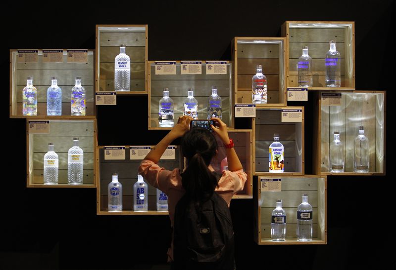 &copy; Reuters. FILE PHOTO: A visitor takes photos of limited edition Absolut Vodka bottles at the "Absolut Canvas" vodka exhibition at the Singapore National Museum August 28, 2013. REUTERS/Edgar Su/File Photo