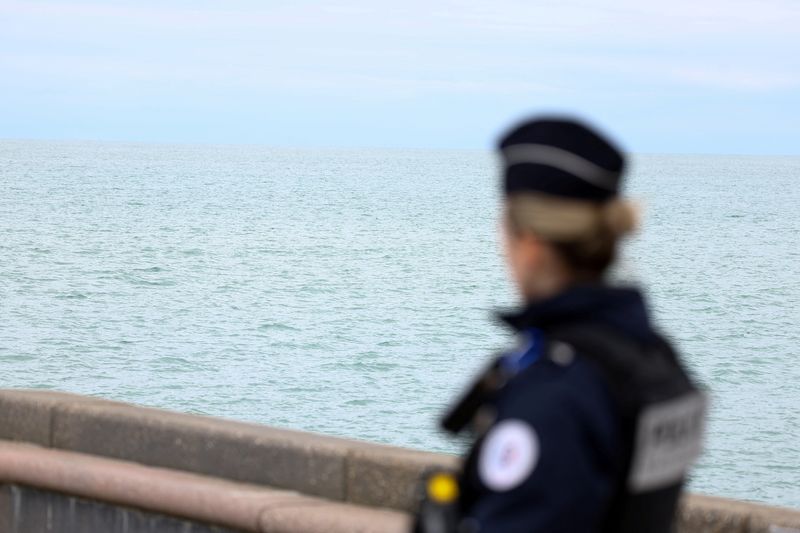 &copy; Reuters. A police member looks on in Wimereux, near Calais, after migrants died in an attempt to cross the English Channel, in France, April 23, 2024. REUTERS/Yves Herman/File Photo