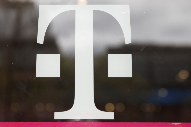 &copy; Reuters. FILE PHOTO: A T-Mobile logo is seen on the storefront door of a store in Manhattan, New York, U.S., April 30, 2018. REUTERS/Shannon Stapleton/File Photo