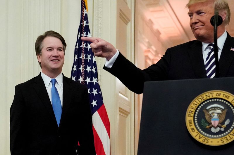 &copy; Reuters. FILE PHOTO: U.S. President Donald Trump speaks next to U.S. Supreme Court Associate Justice Brett Kavanaugh as they participate in a ceremonial public swearing-in at the East Room of the White House in Washington, U.S. October 8, 2018.  REUTERS/Jonathan E