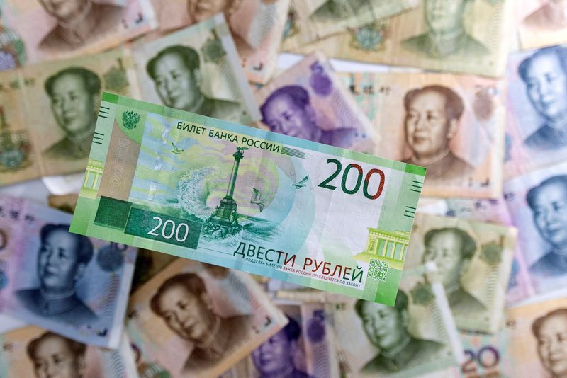&copy; Reuters. FILE PHOTO: Russian Rouble banknote is placed on Chinese Yuan banknotes in this illustration taken May 30, 2022. REUTERS/Dado Ruvic/Illustration/File Photo