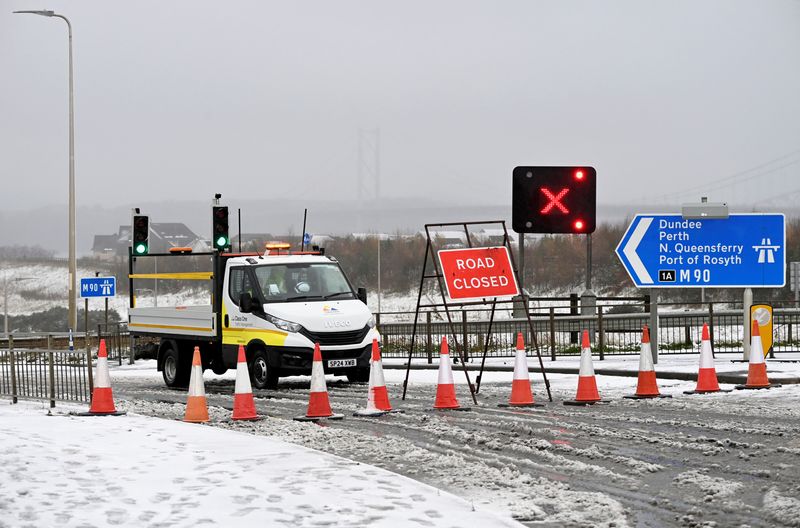 © Reuters. A road is closed as the Queensferry Crossing is closed due to the risk of falling ice, as a result of Storm Bert, near Edinburgh, Scotland, Britain, November 23, 2024. REUTERS/Lesley Martin