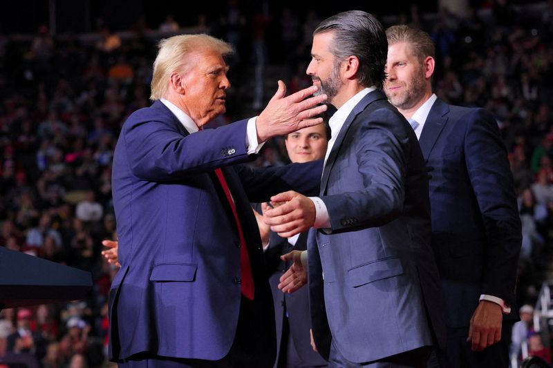 &copy; Reuters. FILE PHOTO: Republican presidential nominee and former U.S. President Donald Trump approaches to embrace Donald Trump Jr at his campaign rally, at PPG Paints Arena in Pittsburgh, Pennsylvania, U.S., November 4, 2024. REUTERS/Brian Snyder/File Photo