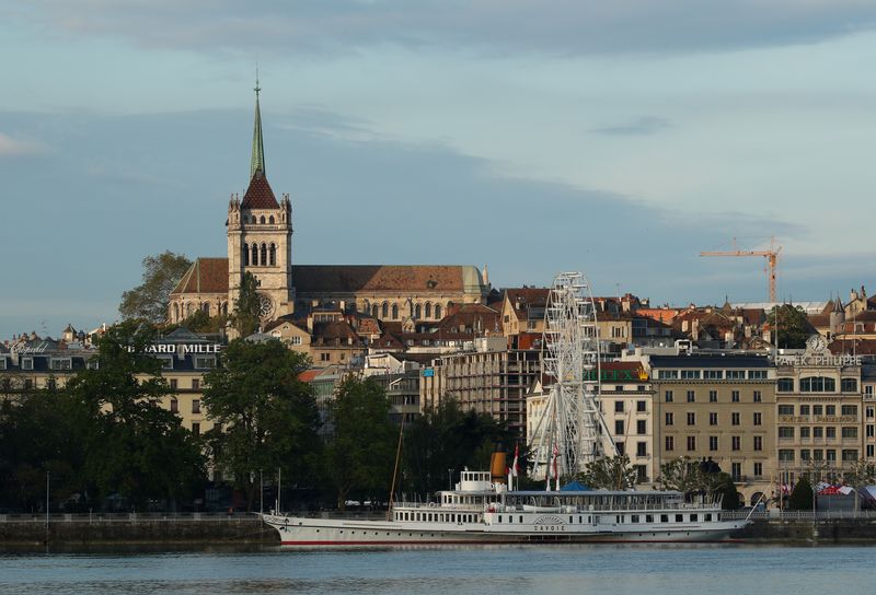 © Reuters. FILE PHOTO: The St. Pierre Cathedral is seen early morning near Lake Leman in Geneva, Switzerland May 27, 2019. REUTERS/Denis Balibouse/File photo