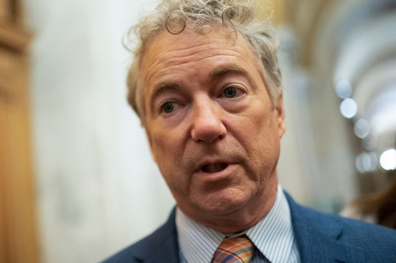 © Reuters. FILE PHOTO: U.S. Senator Rand Paul (R-KY) speaks with members of the media ahead of a Senate vote to begin work on a bill that includes aid for Ukraine, Israel and Taiwan in Washington, U.S., February 9, 2024. REUTERS/Nathan Howard/File Photo