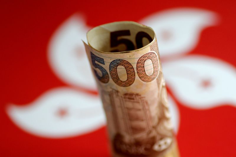 © Reuters. FILE PHOTO: A Hong Kong dollar note is seen in this illustration photo May 31, 2017. REUTERS/Thomas White/Illustration/File Photo