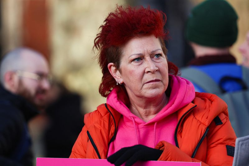 &copy; Reuters. Jenny Carruthers, who is terminally ill and a supporter of the Terminally Ill Adults (End of Life) bill, waits in Parliament Square while British lawmakers debate whether to allow assisted dying for terminally ill adults, in London, Britain, November 29, 