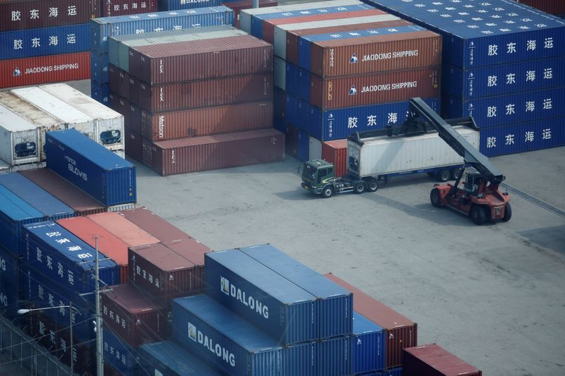 © Reuters. FILE PHOTO: A truck moves a shipping container at Pyeongtaek port in Pyeongtaek, South Korea, July 9, 2020.    REUTERS/Kim Hong-Ji/File Photo