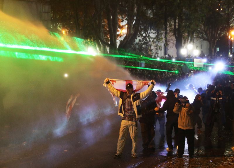 © Reuters. Opposition supporters protest, Tbilisi, December 1, 2024. REUTERS/Irakli Gedenidze