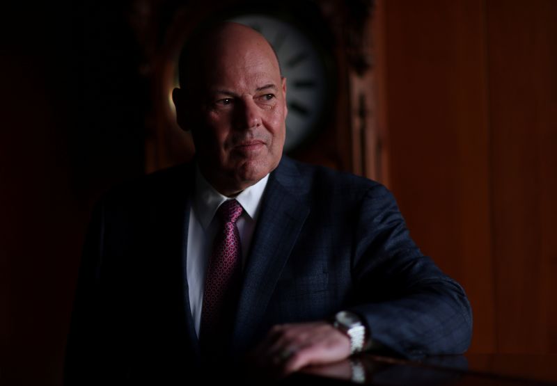 &copy; Reuters. U.S. Postmaster General Louis DeJoy poses for a portrait in his office at the U.S. Postal Service Headquarters in Washington, U.S., April 20, 2022. Picture taken April 20, 2022. REUTERS/Leah Millis/File Photo