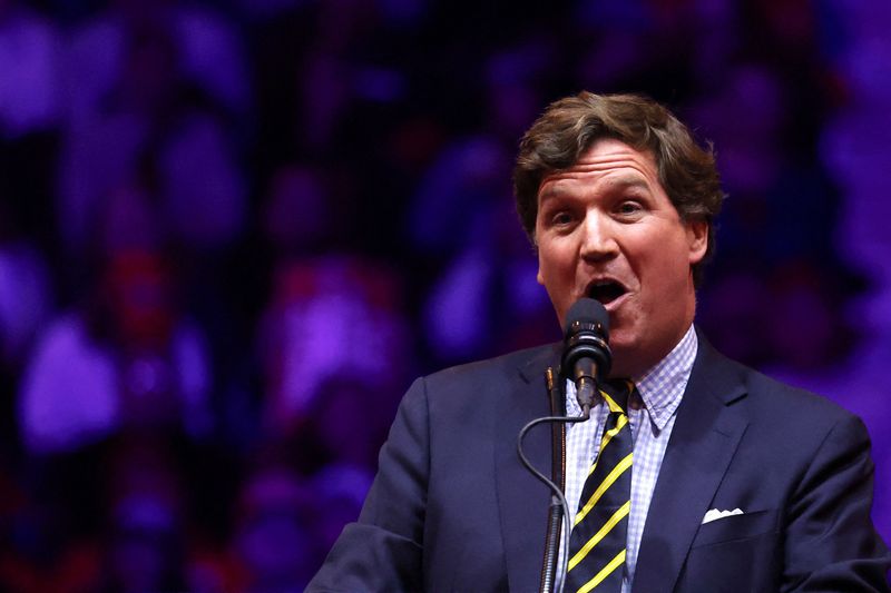 &copy; Reuters. Tucker Carlson, Host of The Tucker Carlson Show, speaks during a rally for Republican presidential nominee and former U.S. President Donald Trump at Madison Square Garden, in New York, U.S., October 27, 2024. REUTERS/Brendan McDermid/File Photo