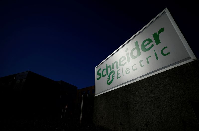 &copy; Reuters. FILE PHOTO: The logo of Schneider Electric is seen outside a company building in Nantes, France, September 20, 2022. REUTERS/Stephane Mahe/File Photo