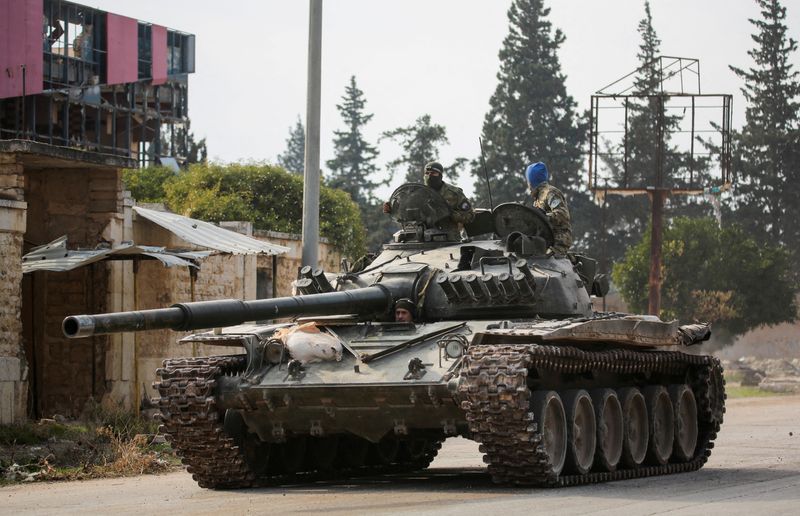 &copy; Reuters. FILE PHOTO: Rebels led by the Islamist militant group Hayat Tahrir al-Sham drive a military vehicle in al-Rashideen, Aleppo province, Syria November 29, 2024. REUTERS/Mahmoud Hasano/File Photo