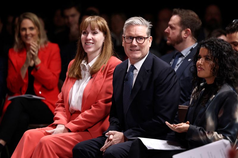 &copy; Reuters. Deputy Leader of the Labour Party Angela Rayner and Britain's Prime Minister Keir Starmer sit at the venue on the day he delivers his speech, 'plan for change' in Buckinghamshire, England, Thursday, Dec. 5, 2024.    Darren Staples/Pool via REUTERS