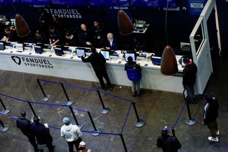 &copy; Reuters. People make their bets at the FANDUEL sportsbook during the Super Bowl LIII in East Rutherford, New Jersey, U.S., February 3, 2019. REUTERS/Eduardo Munoz/ File Photo