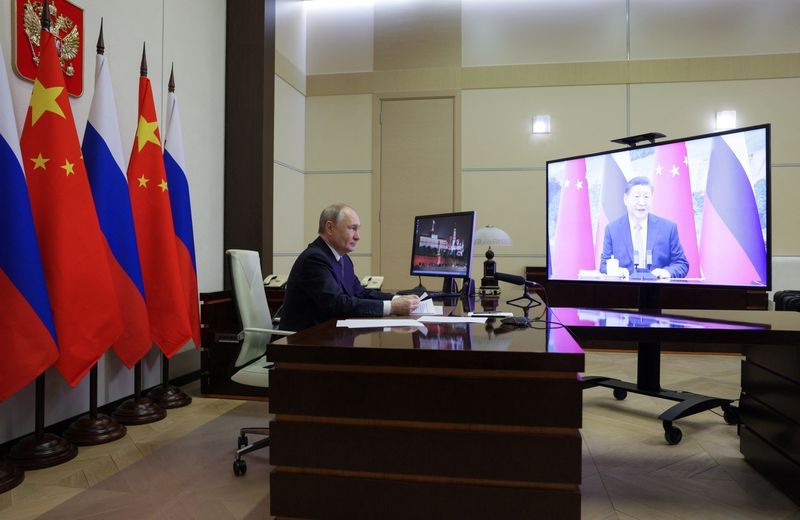 &copy; Reuters. Vladimir Putin em conversa com Xi Jinpingn 21/1/2025   Sputnik/Gavriil Grigorov/Pool via REUTERS