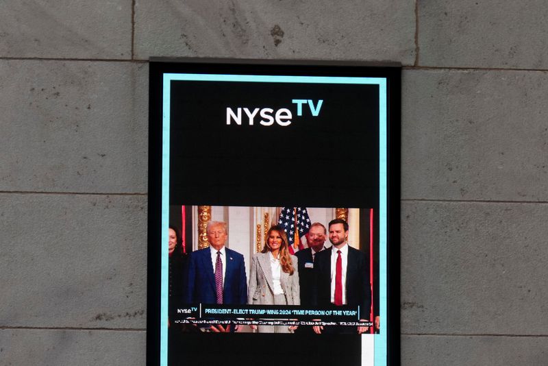 &copy; Reuters. FILE PHOTO: A screen displays an image featuring U.S. President-elect Donald Trump, his wife Melania Trump and U.S. Vice President-elect JD Vance on the wall of the New York Stock Exchange (NYSE), on the day U.S. President-elect Donald Trump is expected t