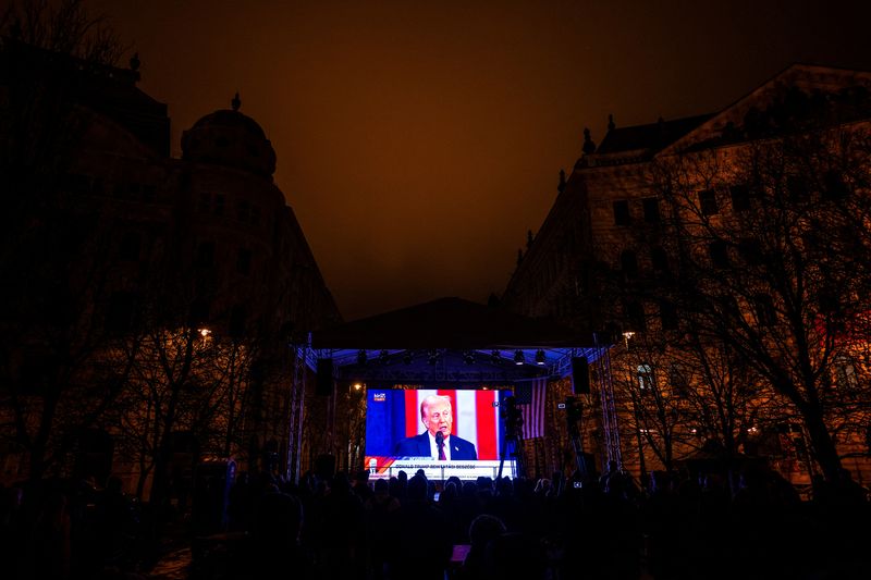  U.S. President Donald Trump is seen on a screen during his speech at an inauguration party held in Budapest outside the U.S. embassy in Budapest, Hungary January 20, 2025. REUTERS/Marton Monus/File Photo