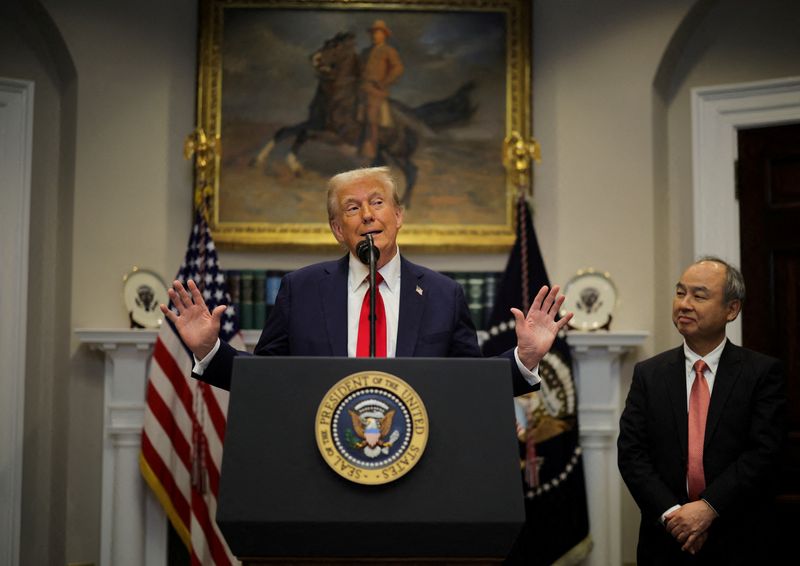  U.S. President Donald Trump delivers remarks on AI infrastructure, next to SoftBank CEO Masayoshi Son at the Roosevelt room at White House in Washington, U.S., January 21, 2025.  REUTERS/Carlos Barria/File Photo