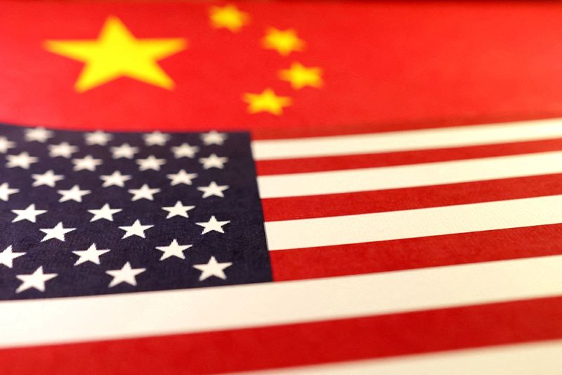  U.S. and Chinese flags are seen in this illustration taken January 8, 2025. REUTERS/Dado Ruvic/Illustration/File Photo/File Photo