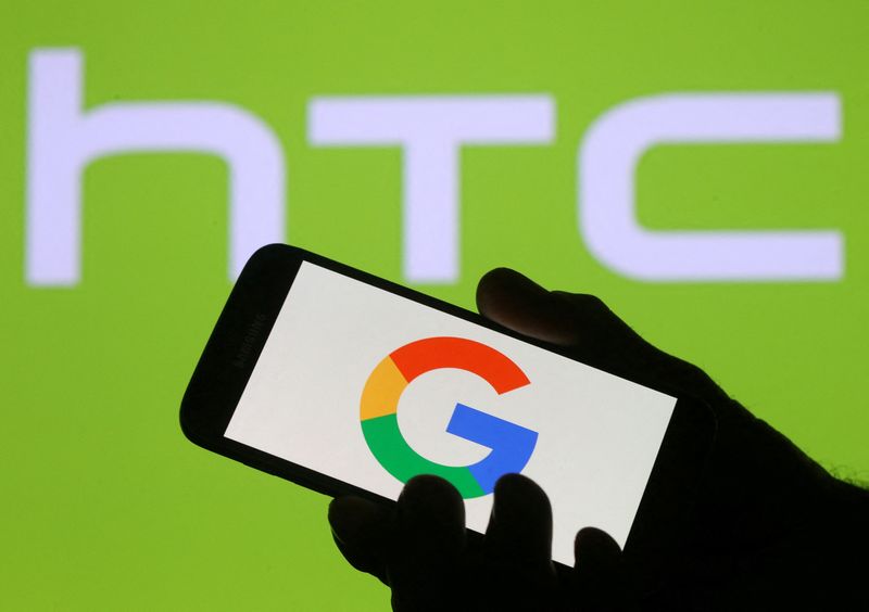 © Reuters. FILE PHOTO: The Google logo is seen on a smartphone in front of a displayed HTC logo in this illustration taken September 21, 2017. REUTERS/Dado Ruvic/Illustration/File Photo