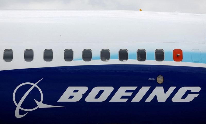  The Boeing logo is seen on the side of a Boeing 737 MAX at the Farnborough International Airshow, in Farnborough, Britain, July 20, 2022.  REUTERS/Peter Cziborra/File Photo