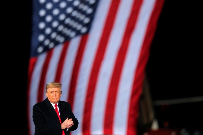 © Reuters. FILE PHOTO: U.S. President Donald Trump is seen in front of a U.S. flag in Dalton, Georgia, U.S., January 4, 2021. REUTERS/Brian Snyder/File Photo