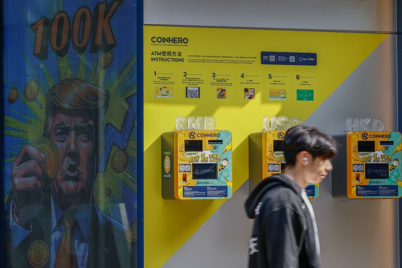 &copy; Reuters. An illustration featuring U.S. President-elect Donald Trump holding Bitcoin is displayed outside a cryptocurrency exchange store after Bitcoin soars above $100,000, in Hong Kong, China, December 5, 2024. REUTERS/Tyrone Siu/File Photo