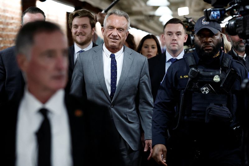  Robert Kennedy Jr., U.S. President-elect Donald Trump's nominee to run the Department of Health and Human Services, walks through the Russell Senate Office Building between meetings with senators on Capitol Hill in Washington, U.S., December 17, 2024. REUTERS/Benoit Tessier/File Photo