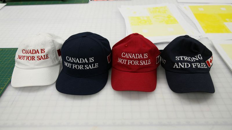 &copy; Reuters. "Canada is not for sale" hats created by Jackpine are displayed at Ontario College of Art & Design University (OCAD University) in Toronto, Ontario, Canada January 22, 2025. REUTERS/Kyaw Soe Oo