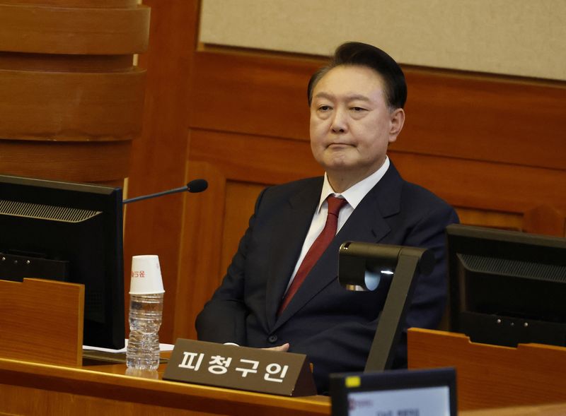 &copy; Reuters. FILE PHOTO: South Korea’s impeached President Yoon Suk Yeol attends the fourth hearing of his impeachment trial over his short-lived imposition of martial law at the Constitutional Court in Seoul, South Korea, 23 January 2025.    JEON HEON-KYUN/Pool via