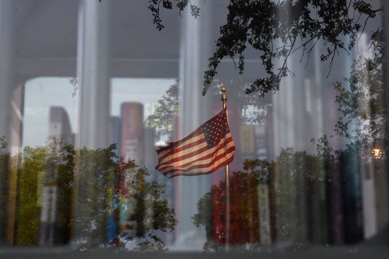 &copy; Reuters. FILE PHOTO: A reflection of an American flag is visible as a Little Free Library invites residents to take books that the library says have been challenged by schools across the state of Texas, in Houston, Texas, U.S. May 3, 2023.   REUTERS/Callaghan O'Ha